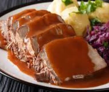 Traditional,German,Cuisine,,Schweinshaxe,Roasted,Ham,Hock.,Beer,,Pretzels,And